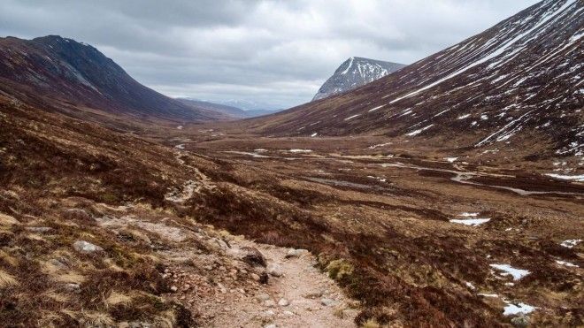 Backpack through Lairig Ghrus subarctic plateau in Scotland