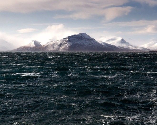 By Dan Brazelton This was taken from the deck of an ocean going tug hiding from 100 knot winds behind the island you can see In the shelter it was only 50 knots And 50 degrees I could only stand for a couple of seconds before the cold was too much and the lense was too wet Then I took some time to warm up and try again This was the best shot