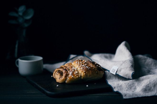 A cinnamon bun and coffee