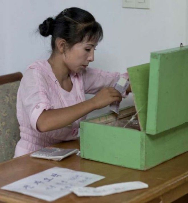 Money Is A Taboo Topic Of Conversation In North Korea. It’s Very Difficult To Understand How Much People Earn, The Cost Of Living, Etc… When I Took This Picture Of The Cashier Of The Brand New Fun Fair Counting A Lot Of Money, It Was Not A Good Idea!