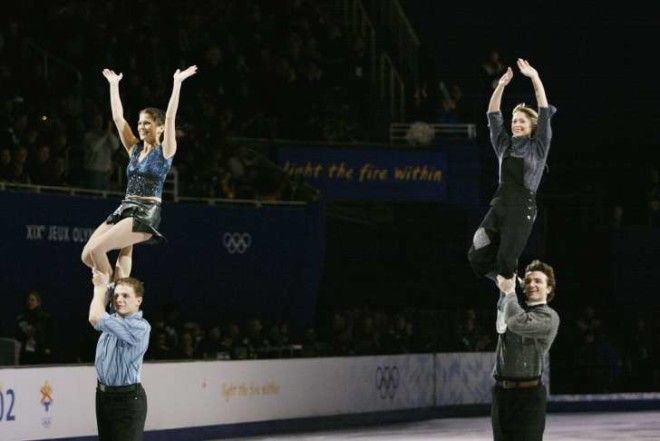 Pairs skaters Jamie Sale and David Pelletier of Canada and Elena Berezhnaya and Anton Sikharulidze of Russia perform in the figure skating exhibition during the Salt Lake City Winter Olympic Games at the Salt Lake Ice Center in Salt Lake City, Utah