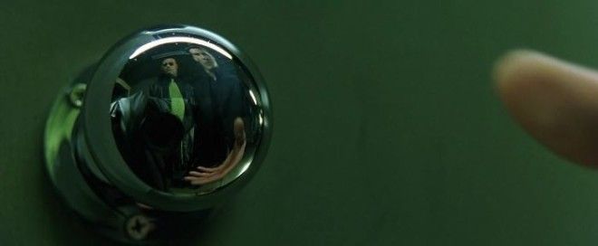 They Couldnt Hide The Camera In The Doorknobs Reflection Of This Scene Of The Matrix So They Put A Coat Over It And A Half Tie To Match With Morpheus