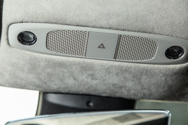 Tesla says the hazard flasher button, up at the front of the roof, is the only button in the whole car.