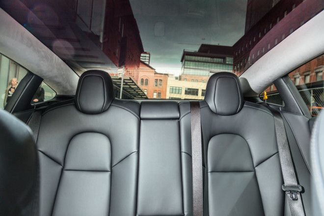 The rear seats are a bench design. And made in-house by Tesla.