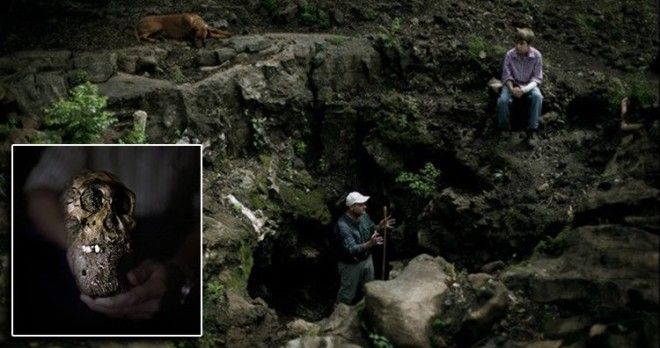 Cranium of Australopithecus sediba, Lee R. Berger, an American paleoanthropologist, with son Matthew and dog Tau, at the at the Malapa site where they discovered the new hominid species.