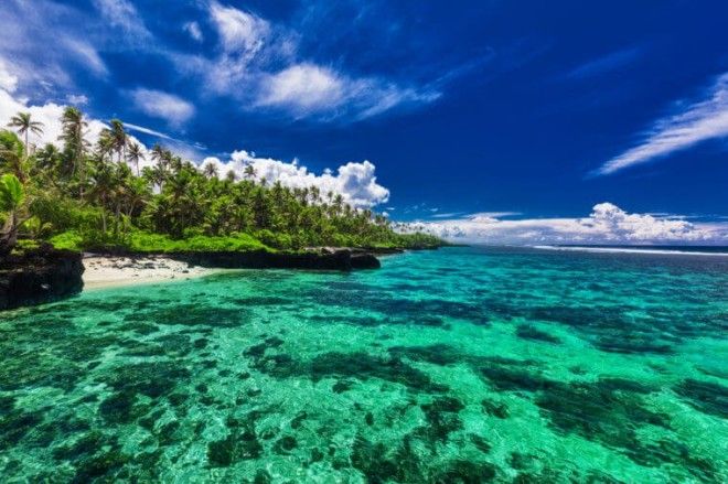 Beach with coral reef on south side of Upolu Samoa Islands