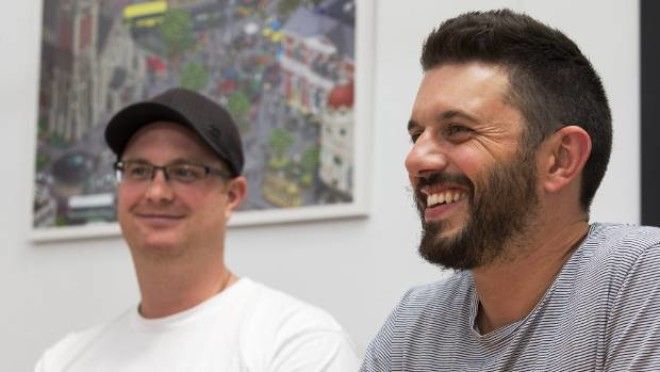 Elliot Gilmore, left and Tim Chesney, both of Make Collective. The company is offering employees $5 every time they bike ...