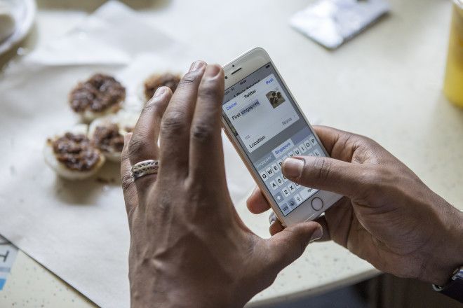 Woman posting a picture to social media