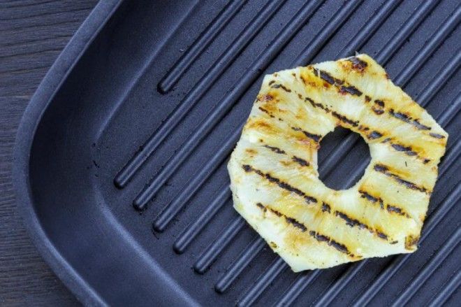 Fried pineapple on the grill Cooking fish burger
