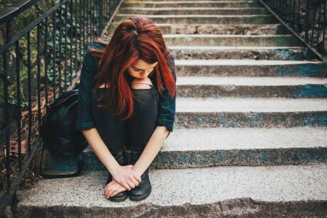 sad woman sad woman on the stairs