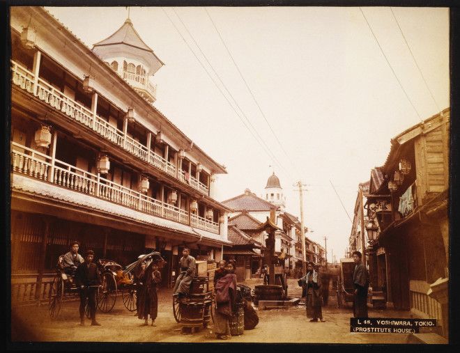 The Yoshiwara District in Tokyo, documented in a hand-colored photograph.